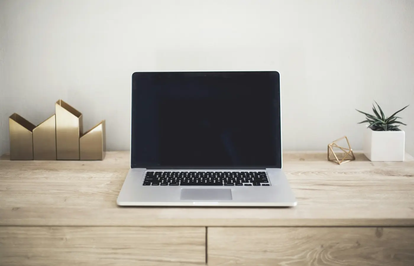 Laptop specification checklist on a desk